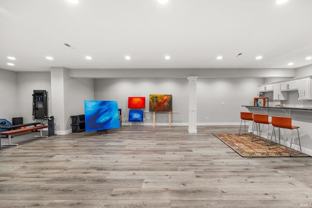 playroom featuring light wood-style flooring, recessed lighting, and baseboards