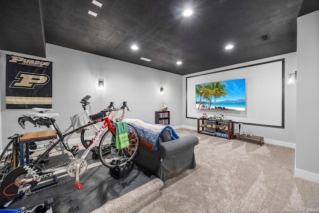 carpeted home theater room featuring baseboards and recessed lighting