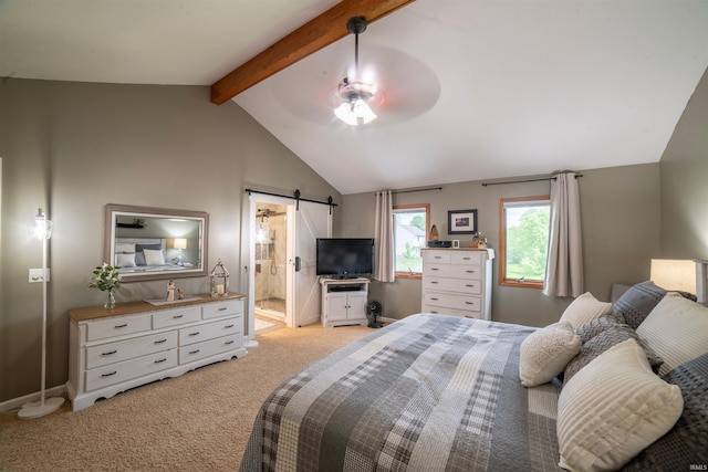 bedroom with a barn door, light colored carpet, baseboards, ceiling fan, and ensuite bath