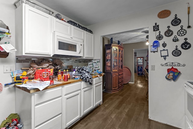 2704 President Ln, Kokomo, IN 46902 - kitchen featuring white appliances, tasteful backsplash, and white cabinetry