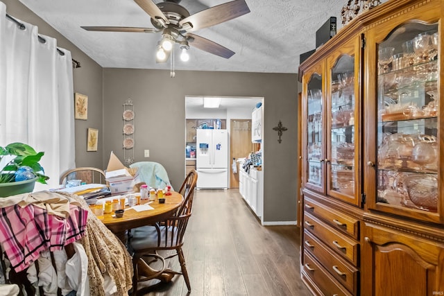 2704 President Ln, Kokomo, IN 46902 - dining space with a ceiling fan, wood finished floors, an office area, and a textured ceiling