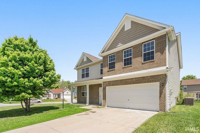 1041 Spring Mill Dr, Kokomo, IN 46902 - view of front of house with brick siding, a front yard, and an attached garage