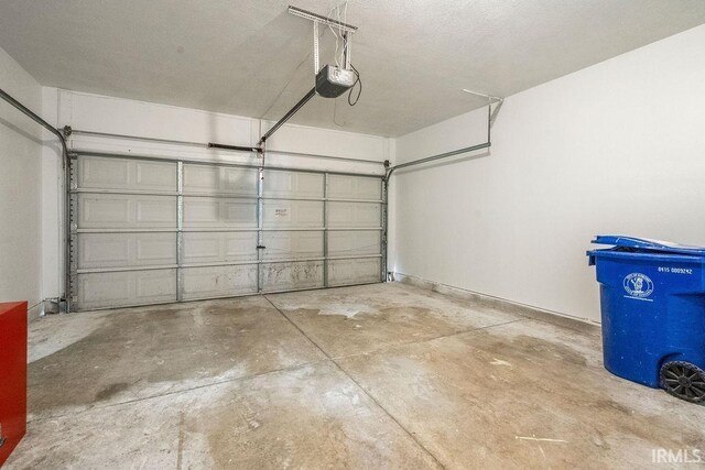 1041 Spring Mill Dr, Kokomo, IN 46902 - garage with a garage door opener
