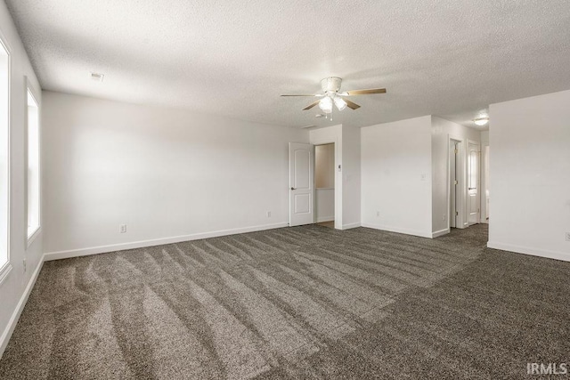 1041 Spring Mill Dr, Kokomo, IN 46902 - empty room featuring ceiling fan, a textured ceiling, baseboards, and dark carpet