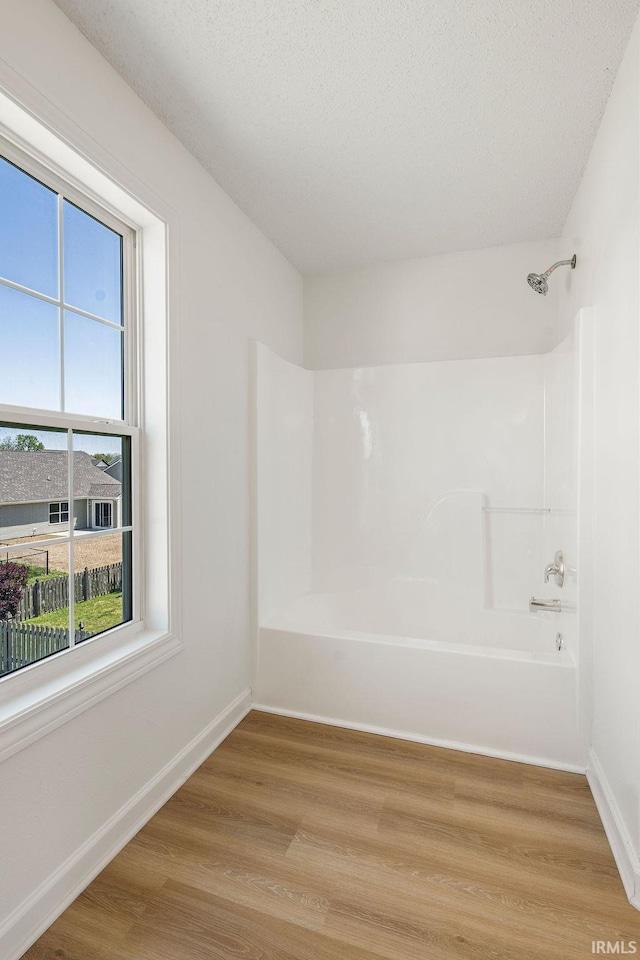 1041 Spring Mill Dr, Kokomo, IN 46902 - spare room with light wood finished floors, baseboards, and a textured ceiling