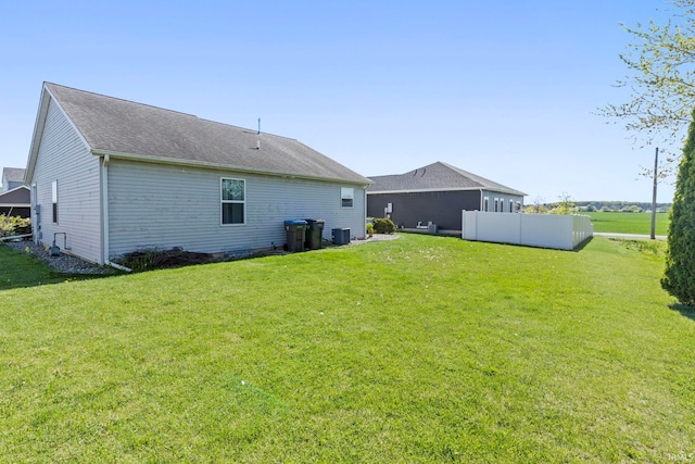 1927 Lighthouse Ln, Goshen, IN 46526 - rear view of house with a lawn, central AC, and a shingled roof