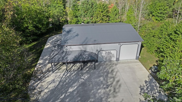 aerial view of property and surrounding area with a forest