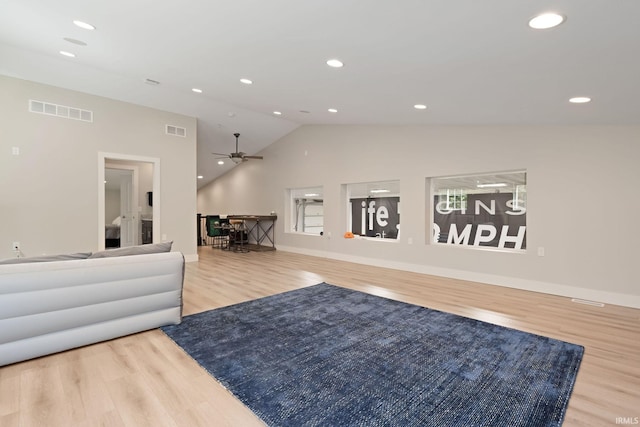 exercise room with wood finished floors, vaulted ceiling, recessed lighting, a ceiling fan, and baseboards