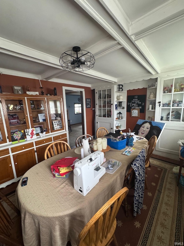 515 E Washington St, Attica, IN 47918 - dining room featuring ceiling fan, carpet, built in features, and crown molding