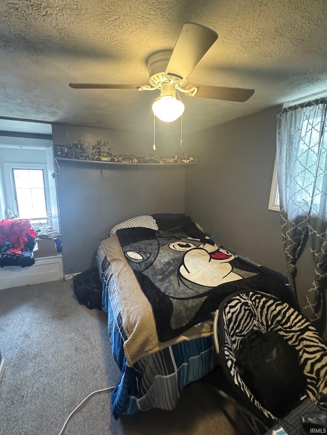 515 E Washington St, Attica, IN 47918 - carpeted bedroom featuring a textured ceiling and a ceiling fan