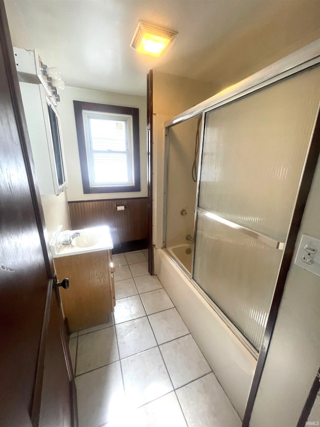 1307 High St, Logansport, IN 46947 - full bath featuring vanity, shower / bath combination with glass door, and tile patterned floors