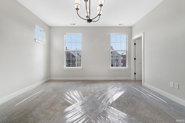 105 Parkerwood Ln, West Lafayette, IN 47906 - empty room featuring carpet floors, a chandelier, and baseboards