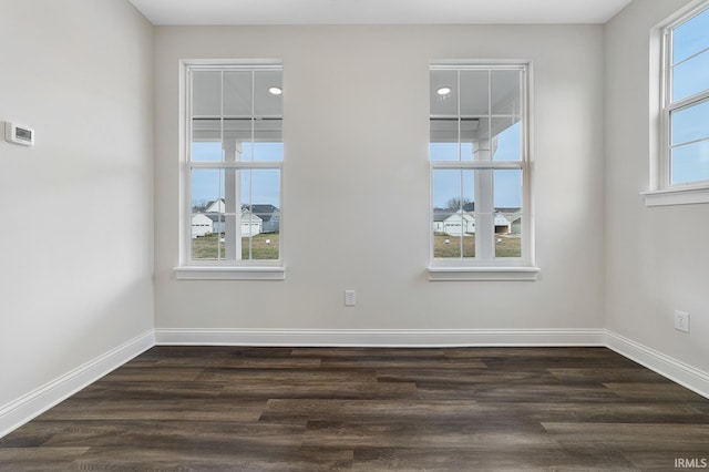 105 Parkerwood Ln, West Lafayette, IN 47906 - spare room featuring dark wood-style flooring and baseboards
