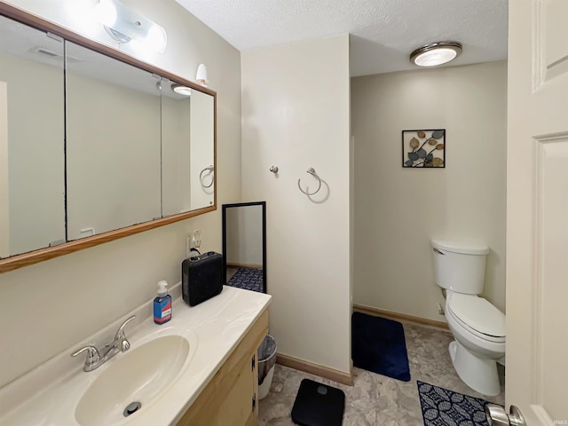 2548 N Letterman Rd, Paragon, IN 46166 - bathroom featuring toilet, vanity, a textured ceiling, and baseboards