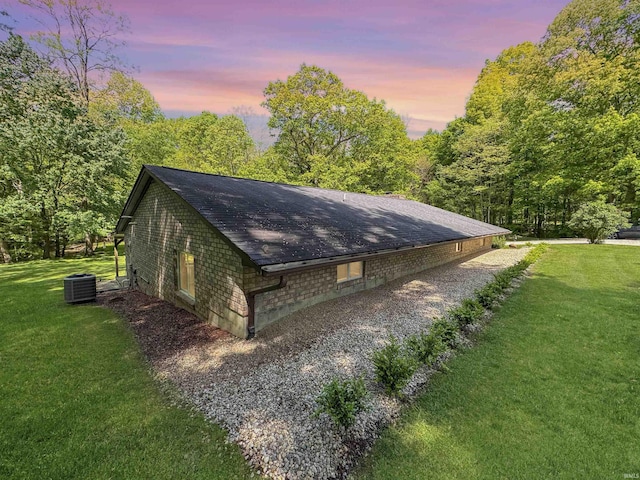 2548 N Letterman Rd, Paragon, IN 46166 - view of side of home with central air condition unit, a yard, and a shingled roof
