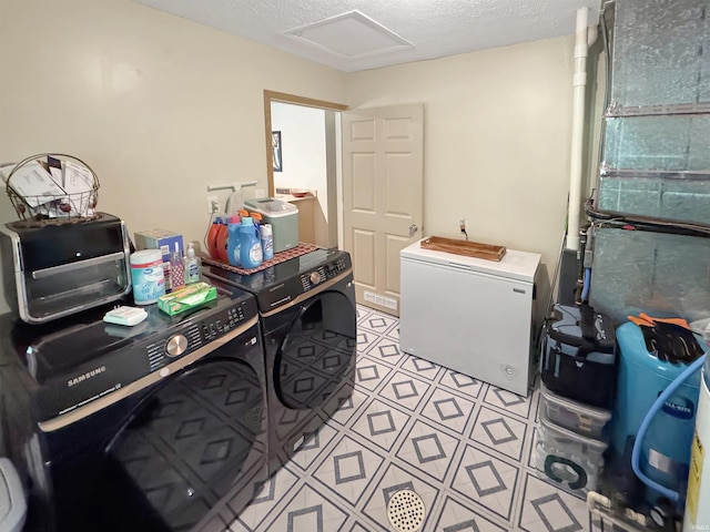 2548 N Letterman Rd, Paragon, IN 46166 - clothes washing area featuring washing machine and dryer, a textured ceiling, and attic access