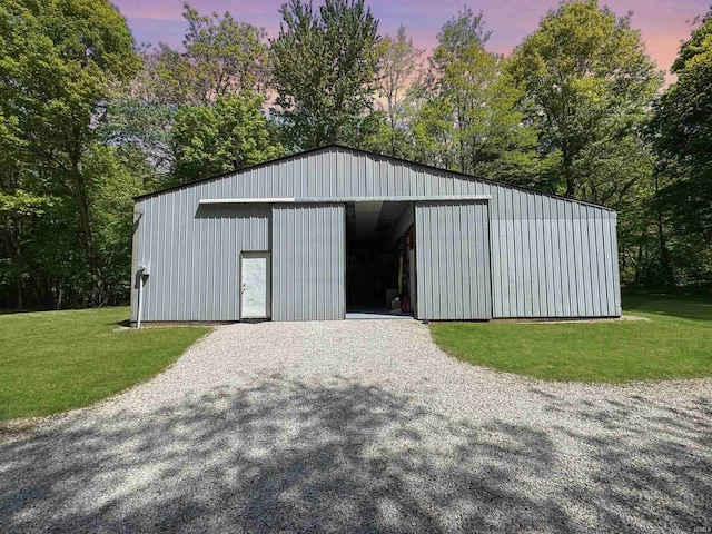 2548 N Letterman Rd, Paragon, IN 46166 - outdoor structure at dusk featuring a lawn, an outbuilding, a pole building, and view of scattered trees