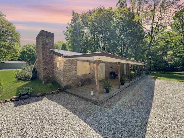 2548 N Letterman Rd, Paragon, IN 46166 - view of front of property with a chimney, a patio, a yard, and brick siding