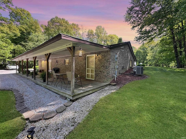 2548 N Letterman Rd, Paragon, IN 46166 - back of house featuring central AC, a lawn, brick siding, and a wooden deck