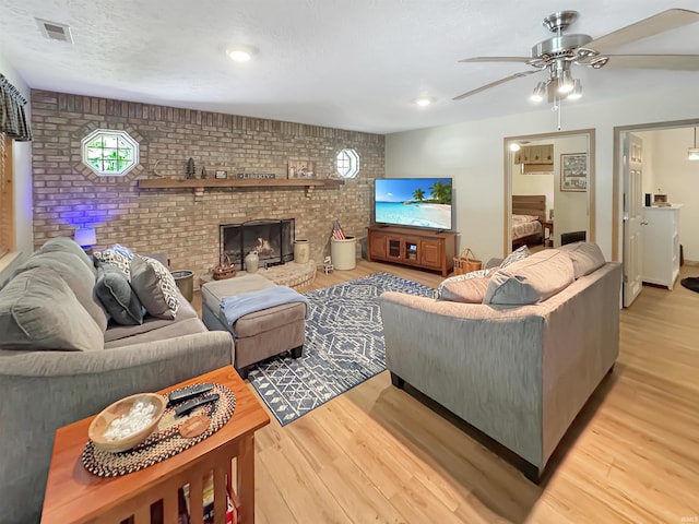 2548 N Letterman Rd, Paragon, IN 46166 - living area with brick wall, light wood finished floors, and a ceiling fan