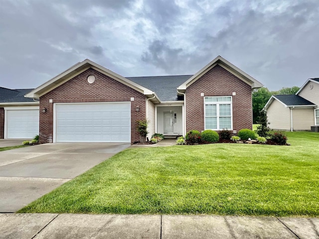 1155 N Fox Ridge Links Dr, Vincennes, IN 47591 - view of front of home featuring brick siding, a front lawn, a garage, and concrete driveway