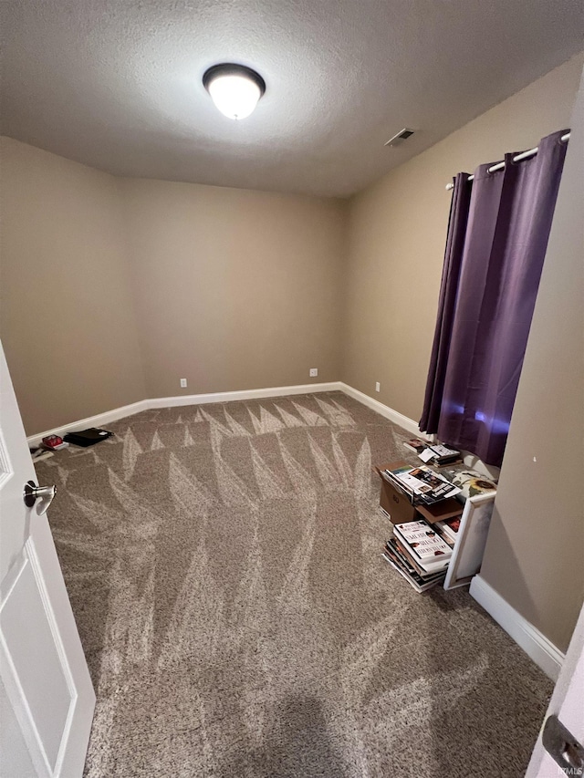 1155 N Fox Ridge Links Dr, Vincennes, IN 47591 - unfurnished room featuring carpet flooring, a textured ceiling, and baseboards