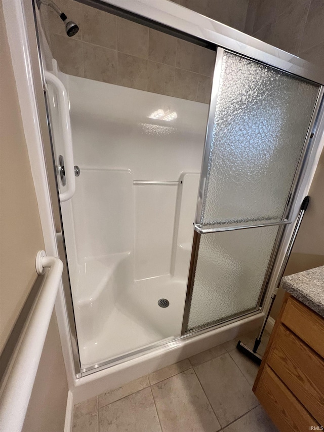1155 N Fox Ridge Links Dr, Vincennes, IN 47591 - bathroom with a shower stall, tile patterned flooring, and vanity