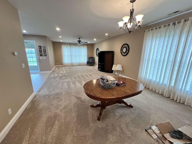 1155 N Fox Ridge Links Dr, Vincennes, IN 47591 - living area with light carpet, healthy amount of natural light, recessed lighting, a chandelier, and a ceiling fan