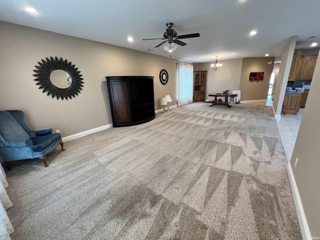 1155 N Fox Ridge Links Dr, Vincennes, IN 47591 - living room featuring light colored carpet, recessed lighting, baseboards, a ceiling fan, and a chandelier