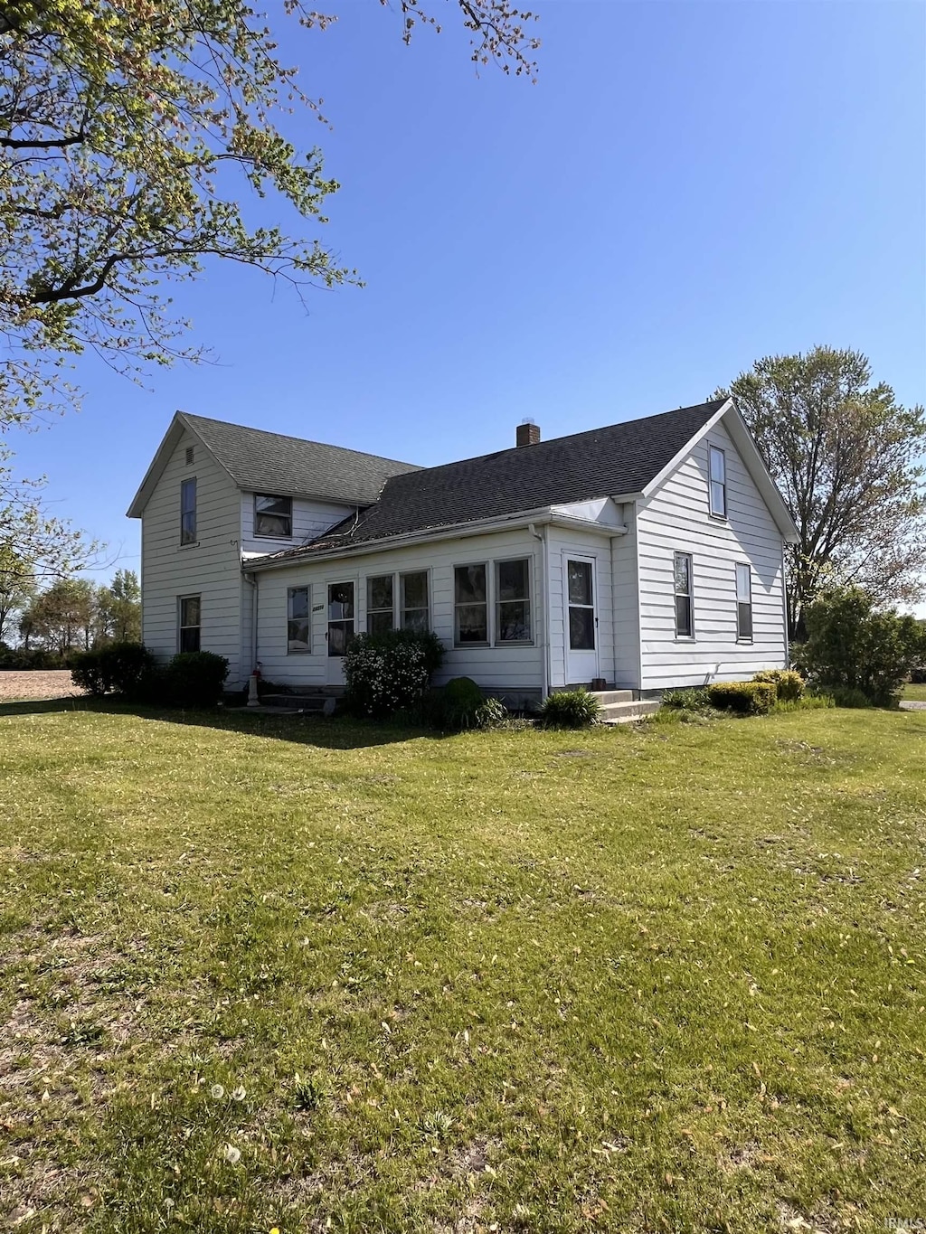 14310 Juniper Rd, Argos, IN 46501 - back of property featuring a lawn, a chimney, and a shingled roof