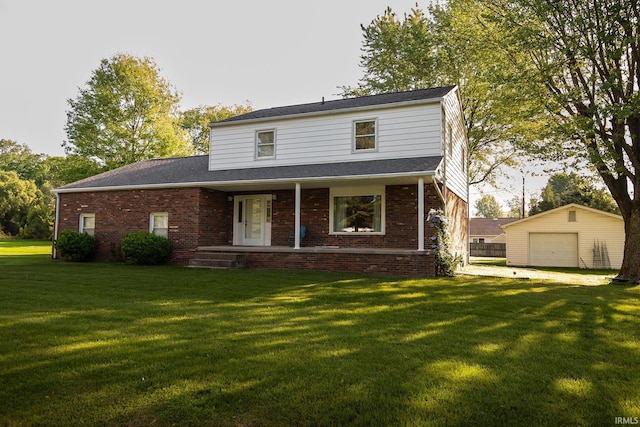 218 S 22nd St, Vincennes, IN 47591 - traditional-style house with brick siding, a porch, an outdoor structure, and a detached garage