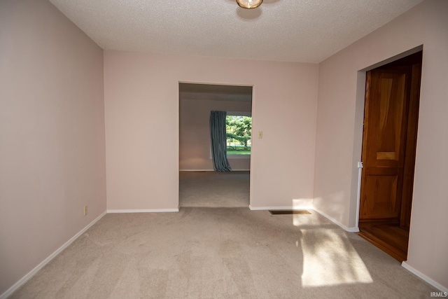 218 S 22nd St, Vincennes, IN 47591 - empty room with carpet floors, a textured ceiling, and baseboards
