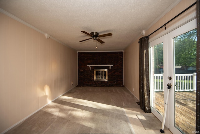 218 S 22nd St, Vincennes, IN 47591 - unfurnished living room featuring a ceiling fan, crown molding, a textured ceiling, carpet floors, and a fireplace