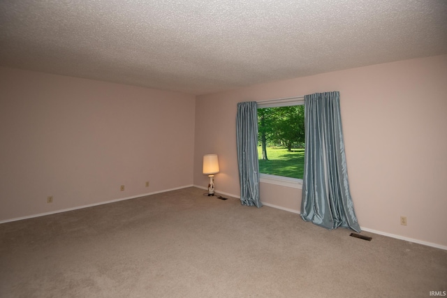 218 S 22nd St, Vincennes, IN 47591 - carpeted spare room featuring a textured ceiling and baseboards