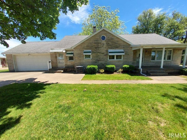1800 N 350 W, Jasper, IN 47546 - single story home featuring stone siding, a chimney, driveway, and a front yard