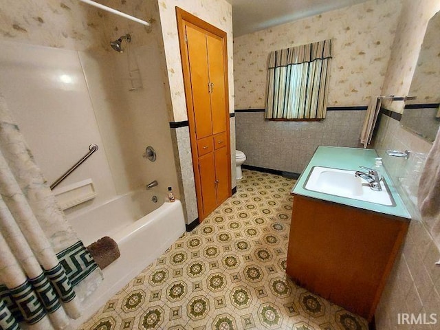 1800 N 350 W, Jasper, IN 47546 - bathroom with wallpapered walls, toilet, wainscoting, vanity, and shower / tub combination