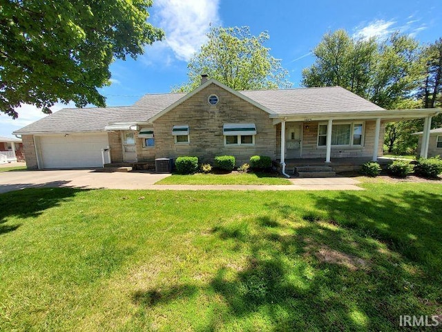 1800 N 350 W, Jasper, IN 47546 - view of front of home featuring stone siding, concrete driveway, a front lawn, a porch, and central air condition unit