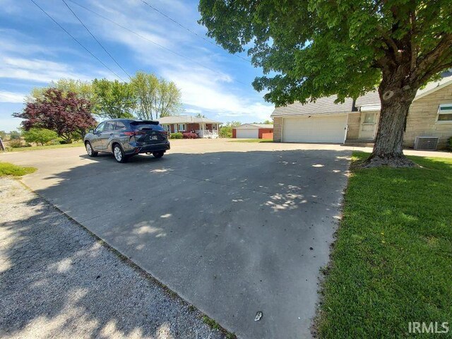 1800 N 350 W, Jasper, IN 47546 - view of front facade with a garage and central air condition unit