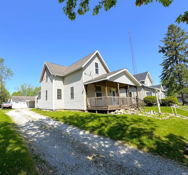 view of front of home featuring covered porch and a front yard