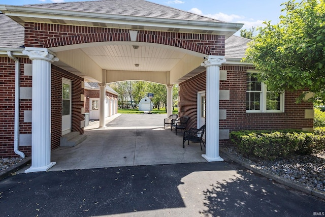 view of car parking featuring a carport and driveway