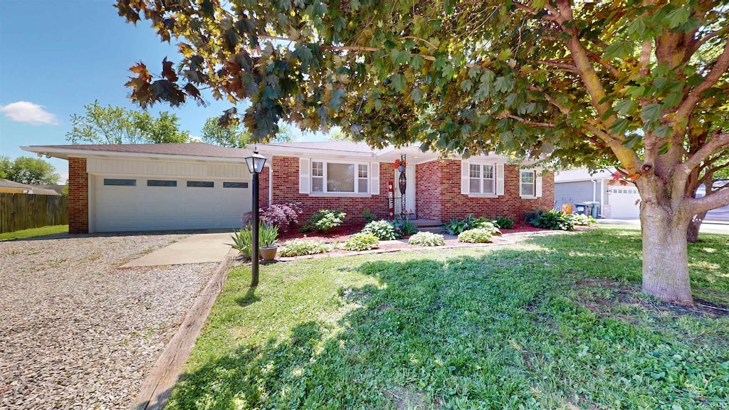 10699 Cricklewood Dr, Newburgh, IN 47630 - view of front of home featuring driveway, a front yard, an attached garage, and brick siding