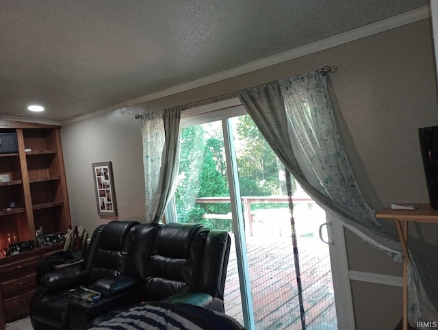 living area with a textured ceiling, crown molding, and recessed lighting