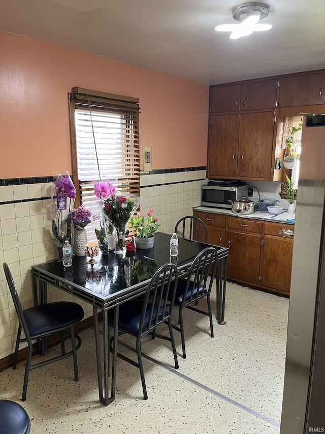 502 W Vantrees St, Washington, IN 47501 - dining space with tile walls and a wainscoted wall