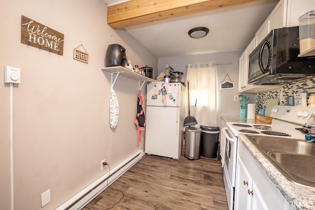 902 E Grant, Hartford City, IN 47348 - kitchen with white appliances, white cabinetry, wood finished floors, beam ceiling, and baseboard heating