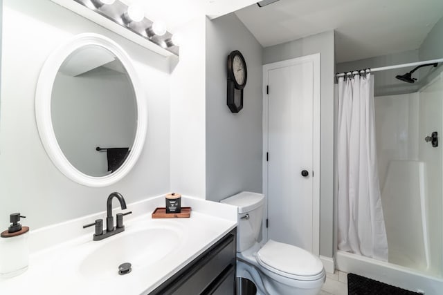 full bath with a shower stall, toilet, vanity, and tile patterned floors