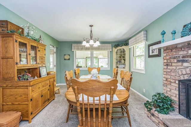 410 Longtree Ln, Logansport, IN 46947 - dining room featuring a chandelier, light carpet, and baseboards