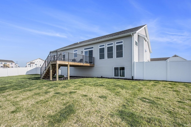 rear view of house featuring a wooden deck and stairway