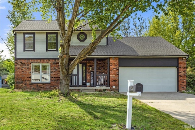 214 Mccutcheon Dr, Lafayette, IN 47909 - traditional home with driveway, a garage, a front yard, and a porch