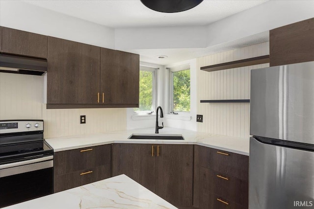 214 Mccutcheon Dr, Lafayette, IN 47909 - kitchen with stainless steel appliances, a sink, under cabinet range hood, open shelves, and dark brown cabinetry