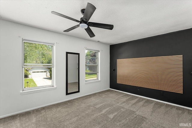 214 Mccutcheon Dr, Lafayette, IN 47909 - carpeted spare room featuring a textured ceiling, a ceiling fan, and baseboards